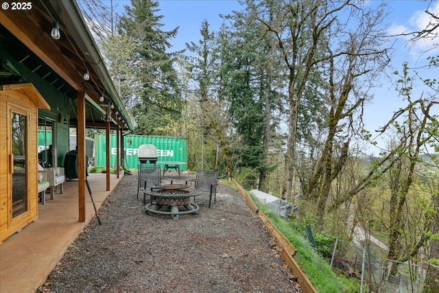823 Terrace Dr, Scotts Mills, OR 97375 - view of patio with an outdoor fire pit and fence