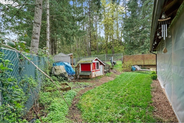 823 Terrace Dr, Scotts Mills, OR 97375 - view of yard featuring a fenced backyard, an outdoor structure, and a shed