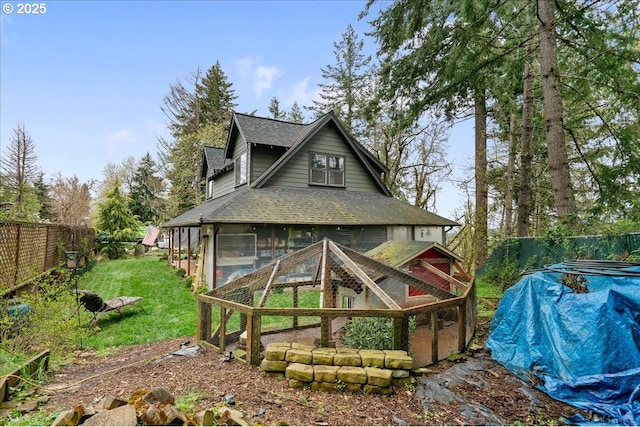 823 Terrace Dr, Scotts Mills, OR 97375 - rear view of house featuring a lawn, roof with shingles, and fence
