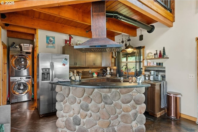 823 Terrace Dr, Scotts Mills, OR 97375 - kitchen with a sink, island range hood, stacked washing maching and dryer, stainless steel fridge, and beamed ceiling