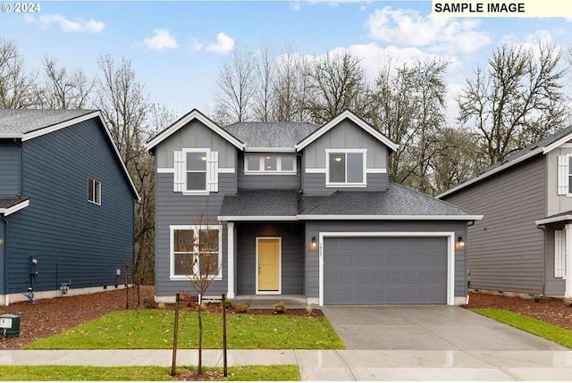 17367 SW Atfalati Ln Unit 42, Sherwood, OR 97140 - traditional home featuring a front lawn, driveway, board and batten siding, a garage, and roof with shingles