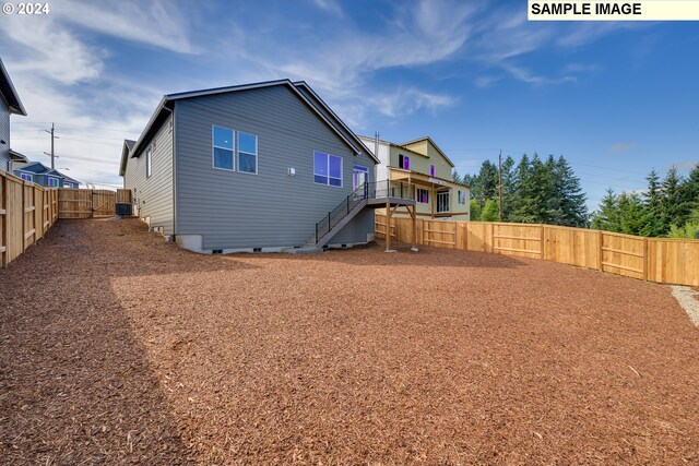 17367 SW Atfalati Ln Unit 42, Sherwood, OR 97140 - back of house with stairway, crawl space, and a fenced backyard