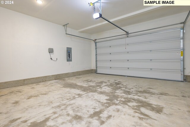 17367 SW Atfalati Ln Unit 42, Sherwood, OR 97140 - garage featuring electric panel and a garage door opener