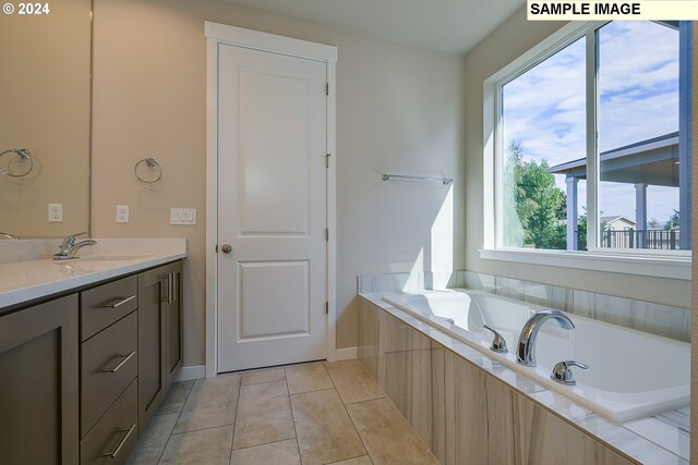 17367 SW Atfalati Ln Unit 42, Sherwood, OR 97140 - full bathroom featuring baseboards, a bath, tile patterned floors, and vanity