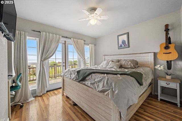 4841 Cedar St, Astoria, OR 97103 - bedroom featuring access to outside, wood finished floors, and ceiling fan