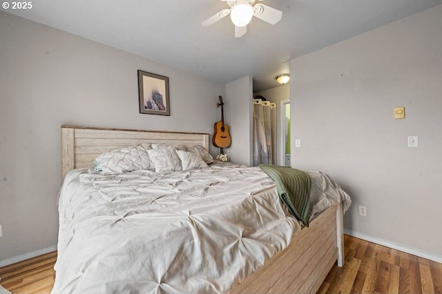 4841 Cedar St, Astoria, OR 97103 - bedroom featuring wood finished floors, baseboards, and ceiling fan