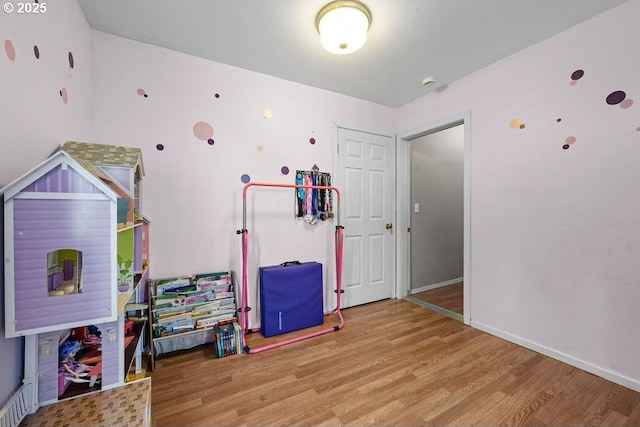 4841 Cedar St, Astoria, OR 97103 - recreation room with baseboards and wood finished floors
