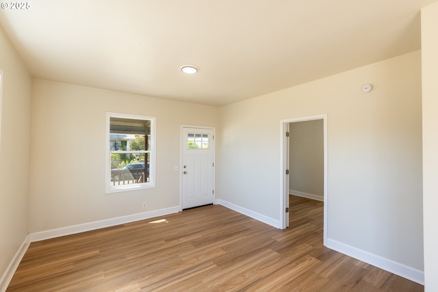 809 E 7th St, The Dalles, OR 97058 - entrance foyer with light wood-style flooring and baseboards