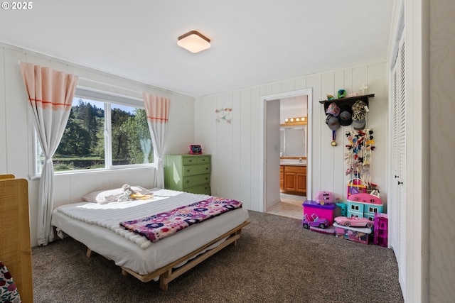 bedroom featuring carpet floors and ensuite bath