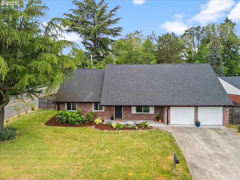 765 SW 136th Ave, Beaverton, OR 97005 - view of front of home featuring brick siding, roof with shingles, concrete driveway, and an attached garage