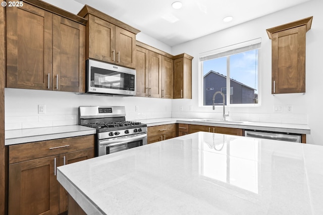 2095 S Heather St, Cornelius, OR 97113 - kitchen featuring appliances with stainless steel finishes, recessed lighting, light countertops, and brown cabinets