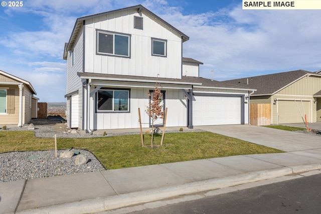 view of front of property with a garage, driveway, fence, board and batten siding, and a front yard