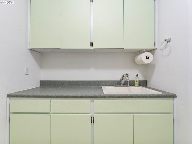 interior space with dark countertops and a sink