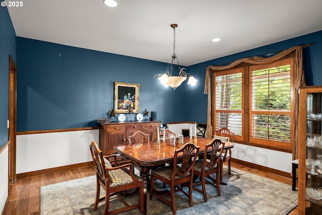 dining room with wood finished floors, baseboards, and recessed lighting