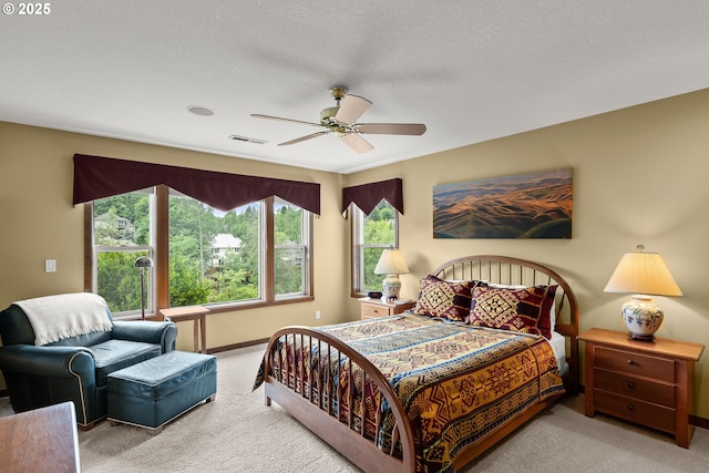 bedroom with carpet floors, baseboards, and ceiling fan