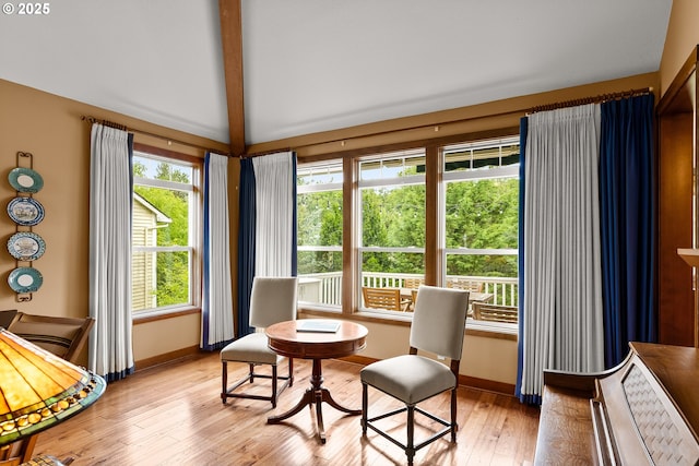 living area with baseboards and light wood-style floors