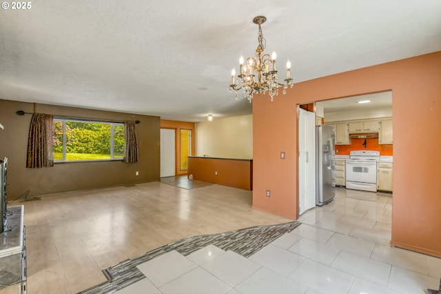 14173 NW Grandview Pl, Banks, OR 97106 - unfurnished living room featuring a chandelier and a textured ceiling