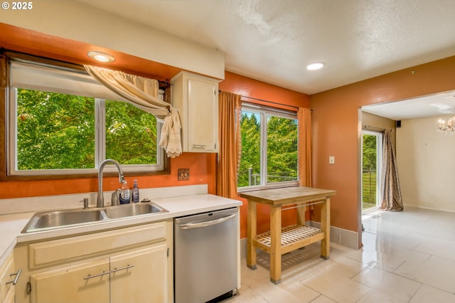 14173 NW Grandview Pl, Banks, OR 97106 - kitchen featuring dishwasher, a sink, light countertops, baseboards, and a chandelier
