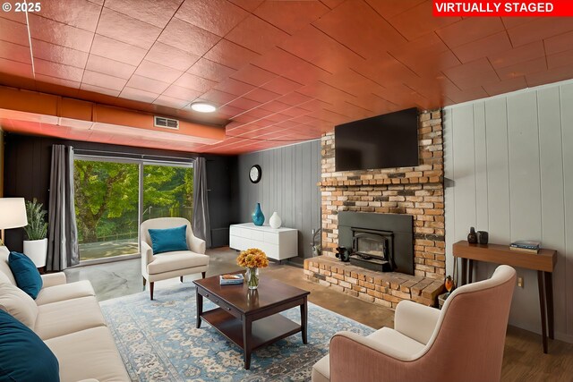 14173 NW Grandview Pl, Banks, OR 97106 - living room with a wood stove and wooden walls