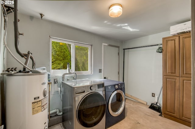 14173 NW Grandview Pl, Banks, OR 97106 - laundry room with water heater and washing machine and clothes dryer