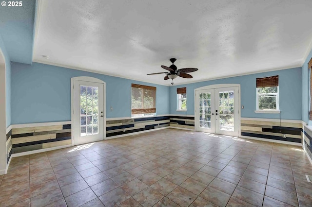 1168 Risden Pl, Eugene, OR 97404 - unfurnished living room featuring french doors, tile patterned floors, and a ceiling fan