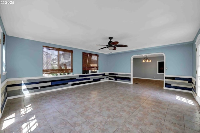 1168 Risden Pl, Eugene, OR 97404 - spare room with arched walkways, ceiling fan, tile patterned flooring, and a chandelier