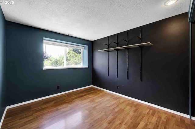 1168 Risden Pl, Eugene, OR 97404 - unfurnished room featuring a textured ceiling and wood finished floors