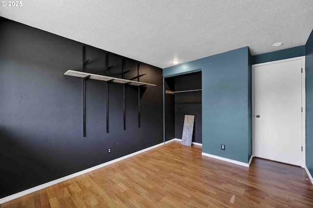 1168 Risden Pl, Eugene, OR 97404 - unfurnished bedroom with a textured ceiling, wood finished floors, and a closet