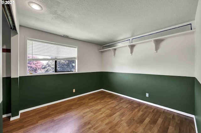 1168 Risden Pl, Eugene, OR 97404 - unfurnished room featuring a textured ceiling and wood finished floors
