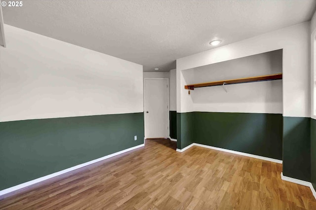 1168 Risden Pl, Eugene, OR 97404 - unfurnished bedroom with wood finished floors, a textured ceiling, and recessed lighting