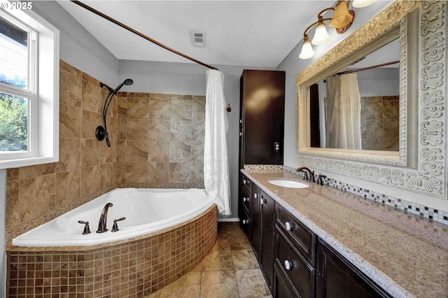 1168 Risden Pl, Eugene, OR 97404 - bathroom featuring vanity and tiled shower / bath combo