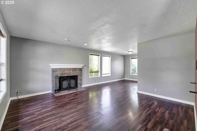1168 Risden Pl, Eugene, OR 97404 - unfurnished living room featuring a textured ceiling, a fireplace, wood finished floors, and recessed lighting