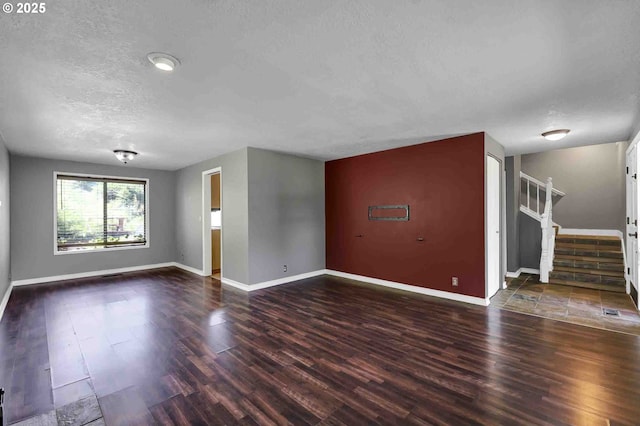 1168 Risden Pl, Eugene, OR 97404 - unfurnished room featuring wood finished floors, a textured ceiling, and stairs