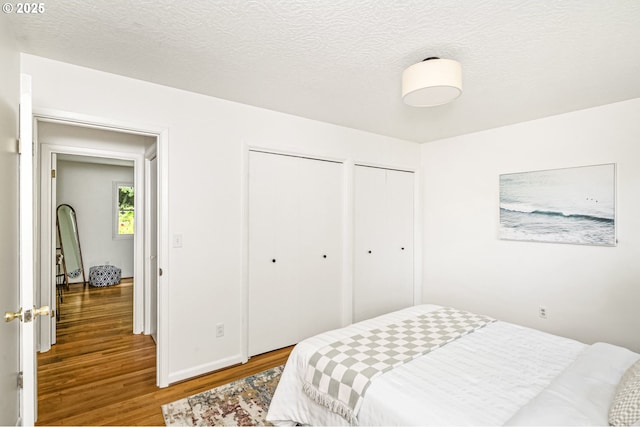 1070 SW Portola Ave, Portland, OR 97225 - bedroom with wood finished floors and multiple closets