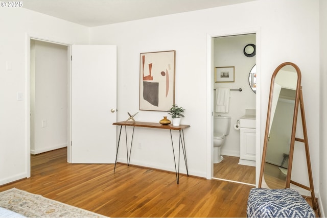 1070 SW Portola Ave, Portland, OR 97225 - bedroom featuring wood finished floors and ensuite bathroom