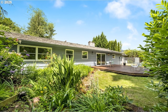 1070 SW Portola Ave, Portland, OR 97225 - rear view of house with a deck, a lawn, and a chimney