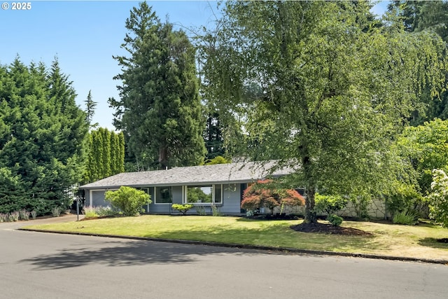 1070 SW Portola Ave, Portland, OR 97225 - view of front of home with a garage and a front yard
