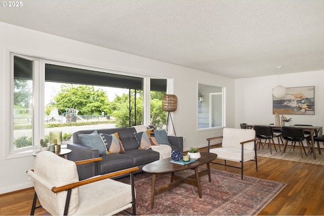1070 SW Portola Ave, Portland, OR 97225 - living room with wood finished floors and a textured ceiling