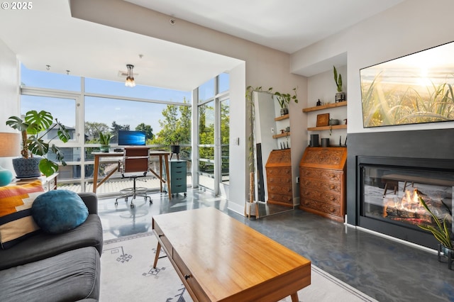 living room featuring a glass covered fireplace