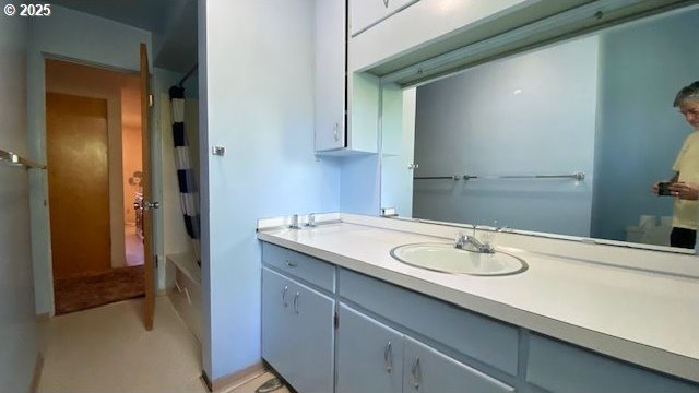 full bath featuring shower / bath combo and vanity