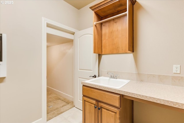 bathroom featuring baseboards and vanity