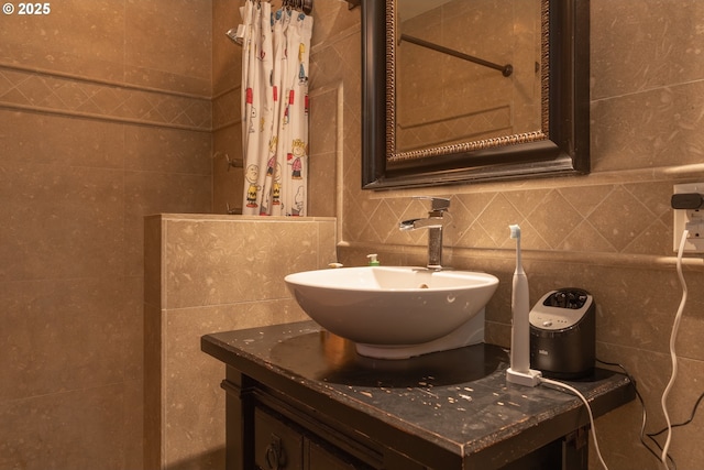 2046 NW Flanders St Unit 13-1, Portland, OR 97209 - full bathroom with tile walls, vanity, tasteful backsplash, and tiled shower