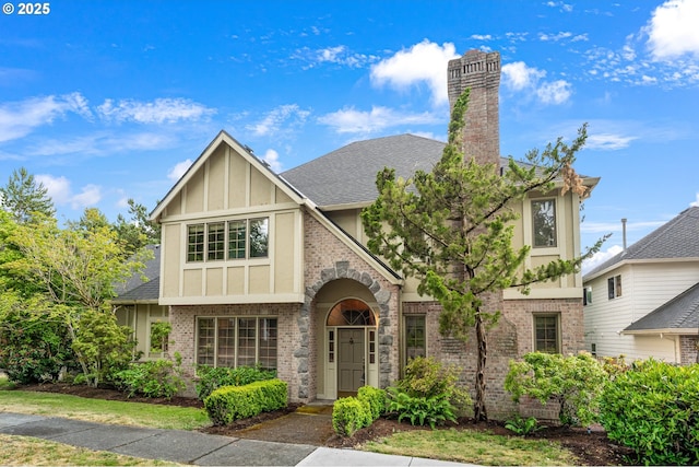 5844 Ridgetop Ct, Lake Oswego, OR 97035 - tudor home with brick siding, a chimney, roof with shingles, and stucco siding