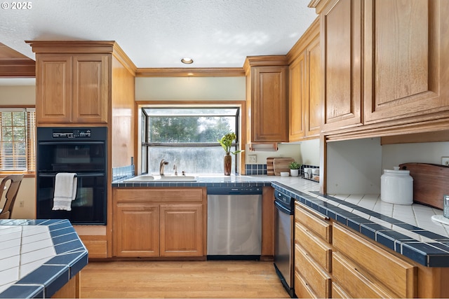 5844 Ridgetop Ct, Lake Oswego, OR 97035 - kitchen featuring stainless steel dishwasher, tile countertops, light wood-style flooring, a textured ceiling, and recessed lighting