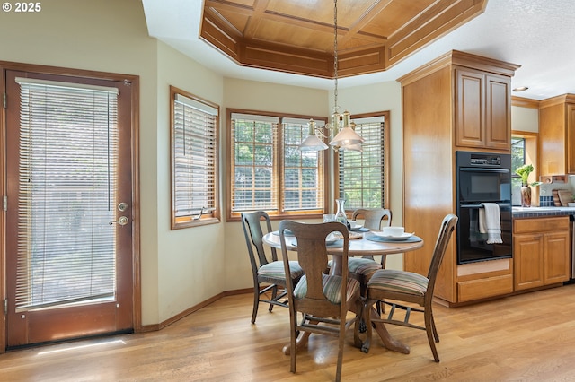 5844 Ridgetop Ct, Lake Oswego, OR 97035 - dining space with coffered ceiling, light wood-type flooring, healthy amount of natural light, and beamed ceiling
