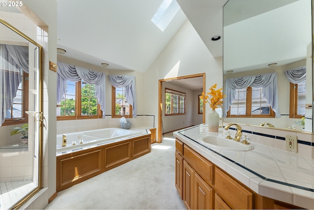5844 Ridgetop Ct, Lake Oswego, OR 97035 - bathroom featuring a skylight, a garden tub, vanity, a shower stall, and high vaulted ceiling
