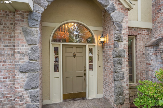 5844 Ridgetop Ct, Lake Oswego, OR 97035 - doorway to property featuring brick siding and stucco siding