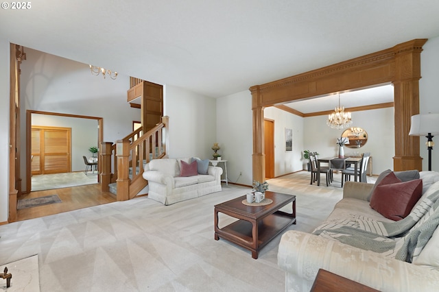 5844 Ridgetop Ct, Lake Oswego, OR 97035 - living room featuring a chandelier, light colored carpet, stairs, and ornamental molding