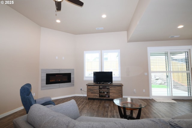 5009 NE 85th St, Vancouver, WA 98665 - living room with baseboards, visible vents, wood finished floors, and a glass covered fireplace