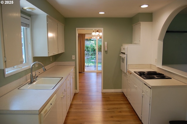 3024 Concord Way, Forest Grove, OR 97116 - kitchen featuring white appliances, a sink, light wood-style floors, white cabinetry, and recessed lighting